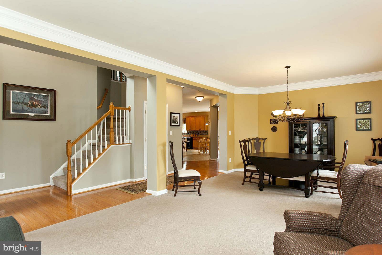 131 Holiday Road Cross Junction, VA 22625 - Photo 4 of 30 a dining room with furniture entryway and wooden floor