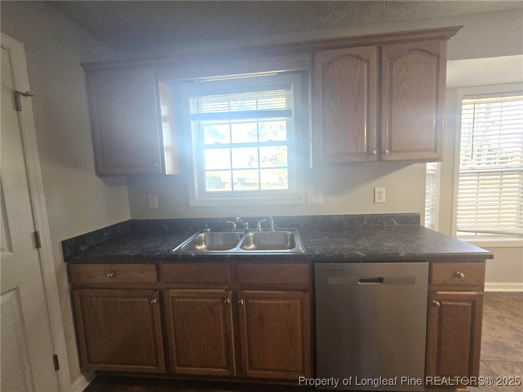 2486 O'Hara Drive Raeford, NC 28376 - Photo 12 of 28 a kitchen with granite countertop cabinets sink and window