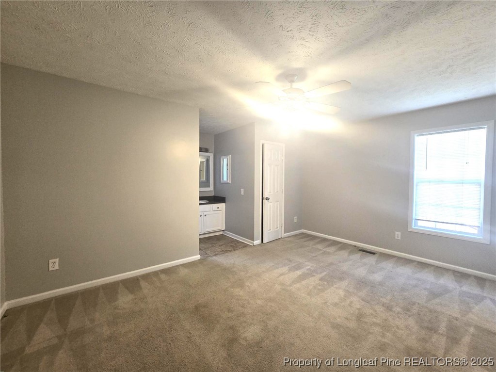 2486 O'Hara Drive Raeford, NC 28376 - Photo 13 of 28 an empty room with windows