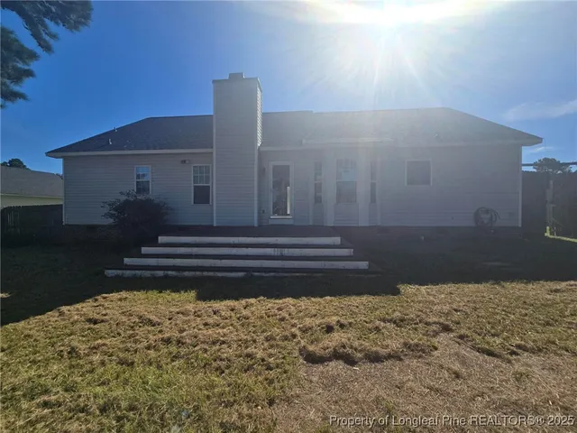a view of a swimming pool with an outdoor space and seating area