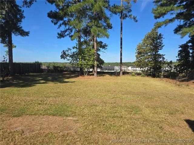 a view of a backyard of the house