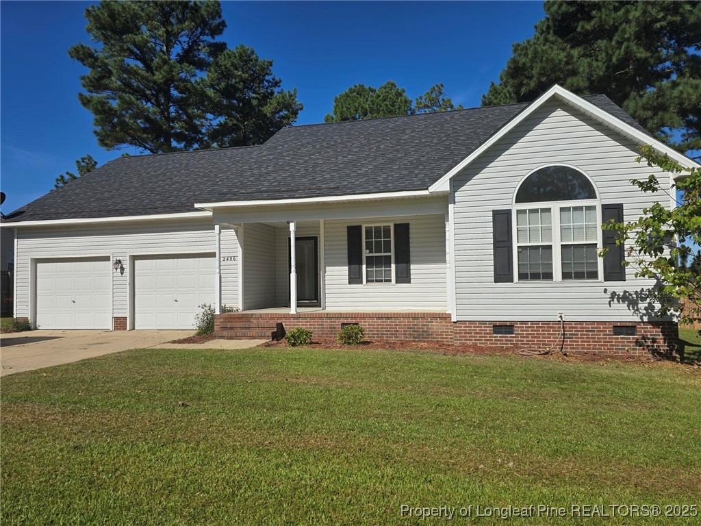 2486 O'Hara Drive Raeford, NC 28376 - Photo 4 of 28 a front view of a house with a yard