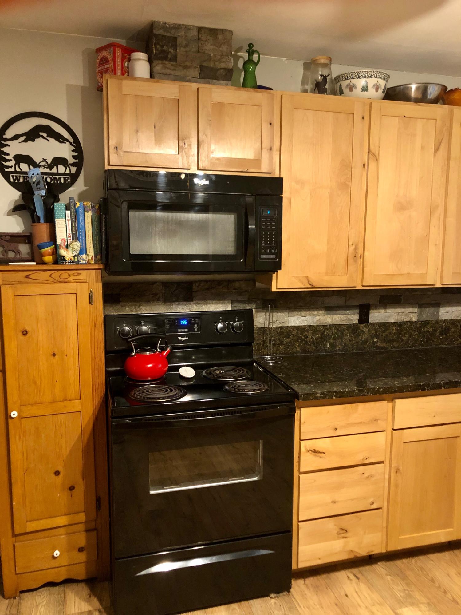 441 Upper Applegate Road Jacksonville, OR 97530 - Photo 8 of 25 a kitchen with a stove and a microwave