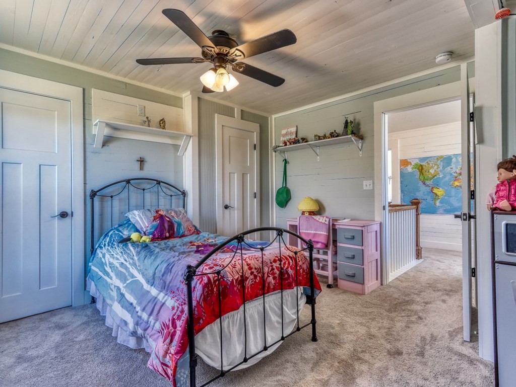 2712 Hodges Ferry Road Kodak, TN 37764 - Photo 30 of 49 a bedroom with bed and a chandelier