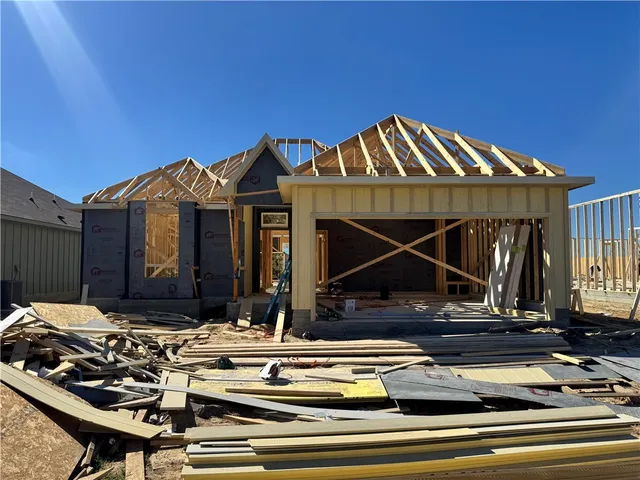a view of house with car parked