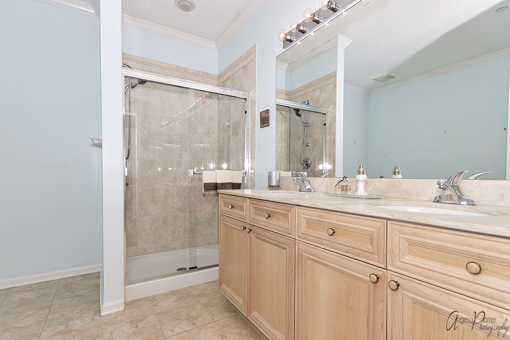 640 McHenry Road, Unit 108 Wheeling, IL 60090 - Photo 11 of 30 a bathroom with a shower sink and mirror