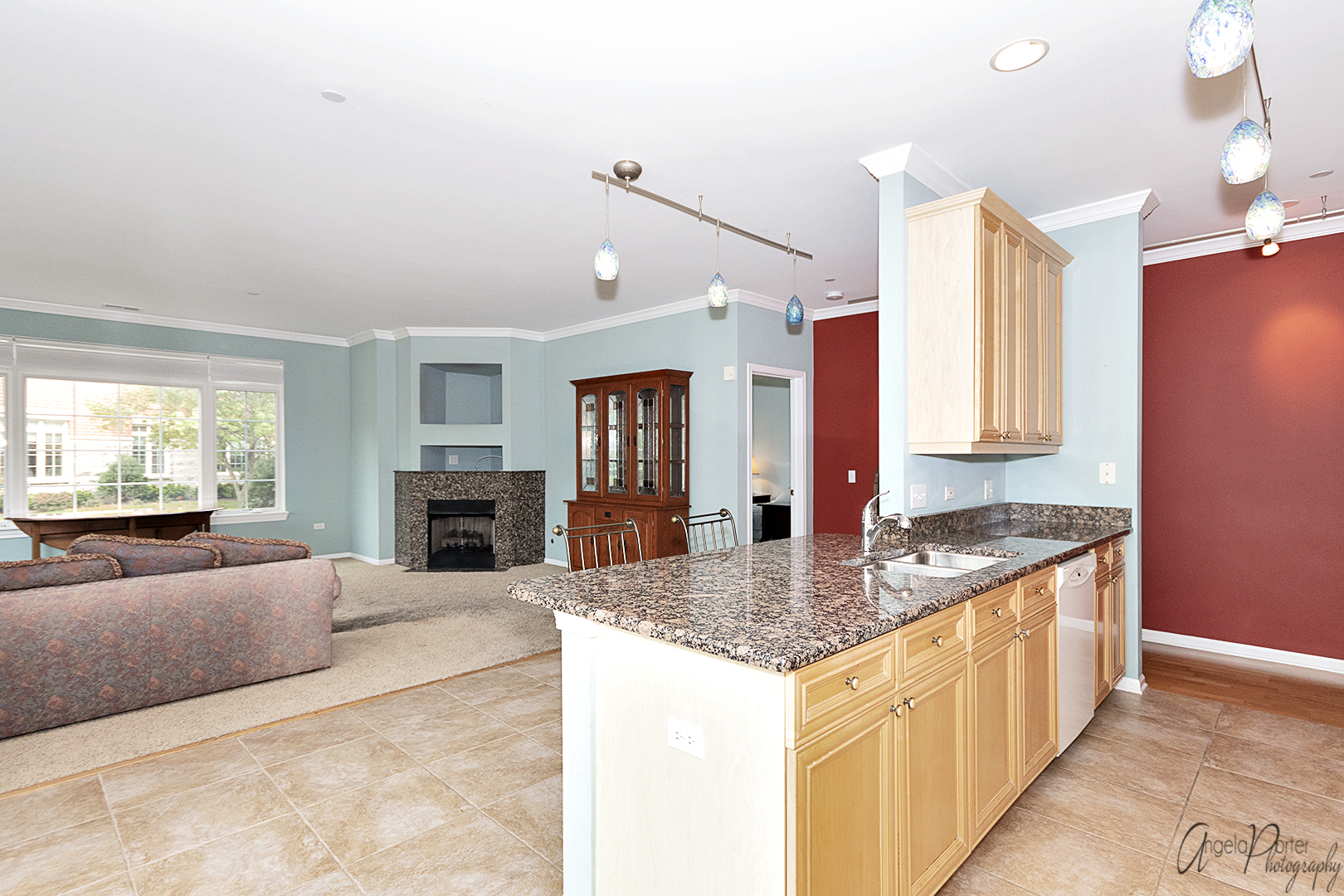 640 McHenry Road, Unit 108 Wheeling, IL 60090 - Photo 13 of 30 a kitchen with granite countertop a sink stove and cabinets