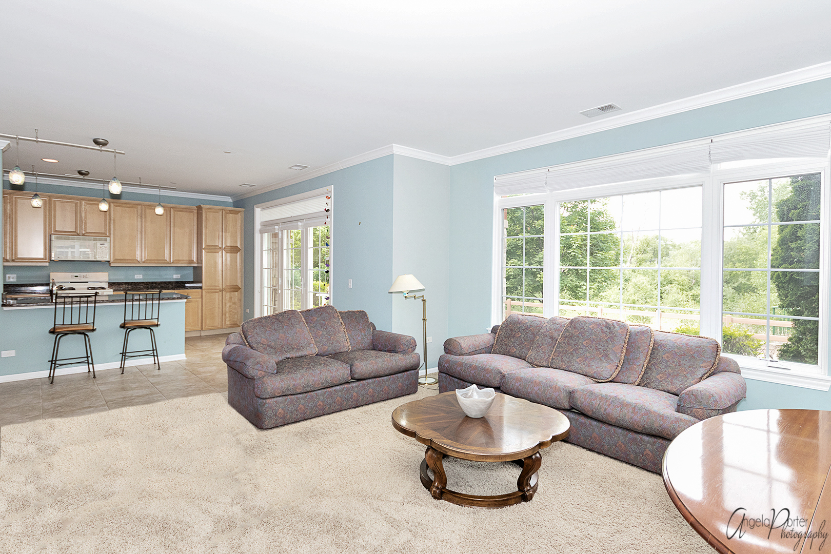 640 McHenry Road, Unit 108 Wheeling, IL 60090 - Photo 19 of 30 a living room with furniture and a large window