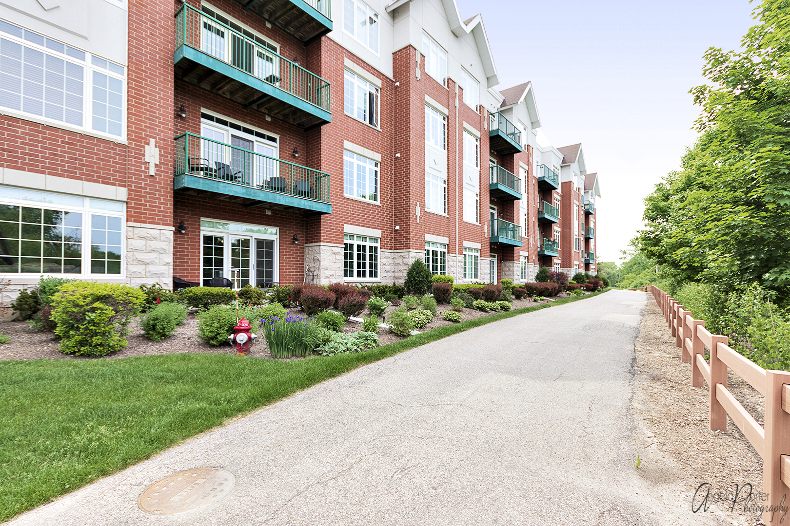 640 McHenry Road, Unit 108 Wheeling, IL 60090 - Photo 25 of 30 a front view of a building with garden