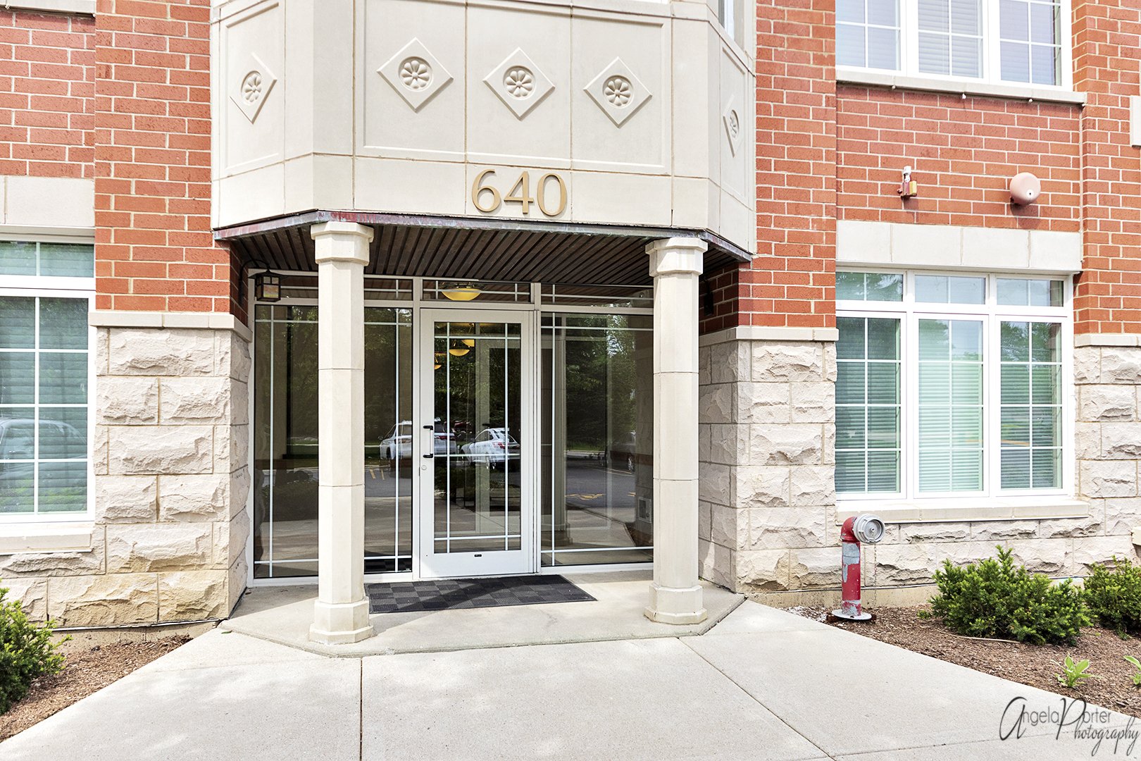 640 McHenry Road, Unit 108 Wheeling, IL 60090 - Photo 26 of 30 a front view of a building with a entrance