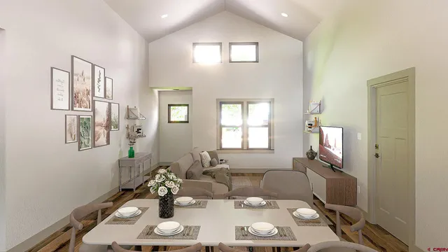 a view of a livingroom with furniture and a window