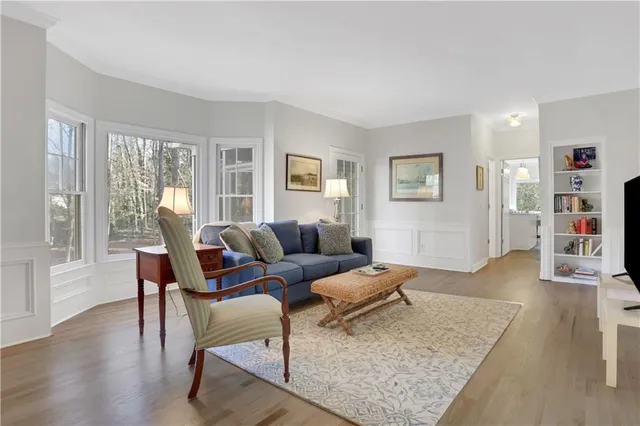 a kitchen with stainless steel appliances a refrigerator stove microwave and white cabinets