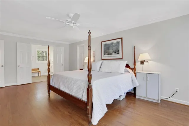 a bathroom with a tub shower sink and mirror