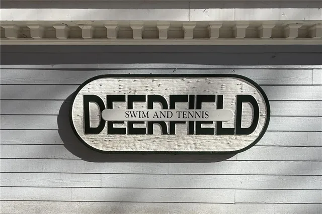 an aerial view of residential house with parking