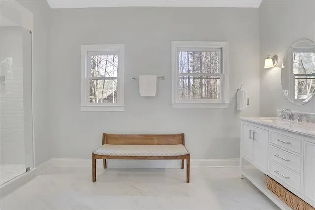 a spacious bedroom with a bed and a window