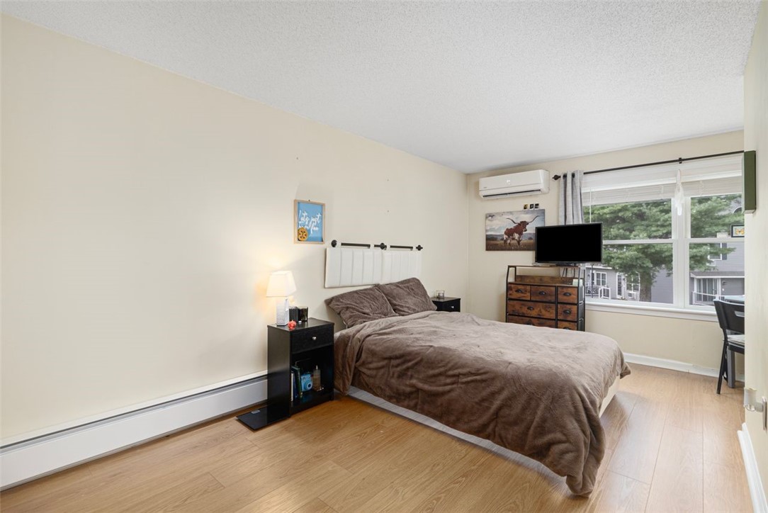 200 Post Road, Unit 109 Warwick, RI 02888 - Photo 19 of 36 Primary bedroom - two closets, mini ductless Heat/AC