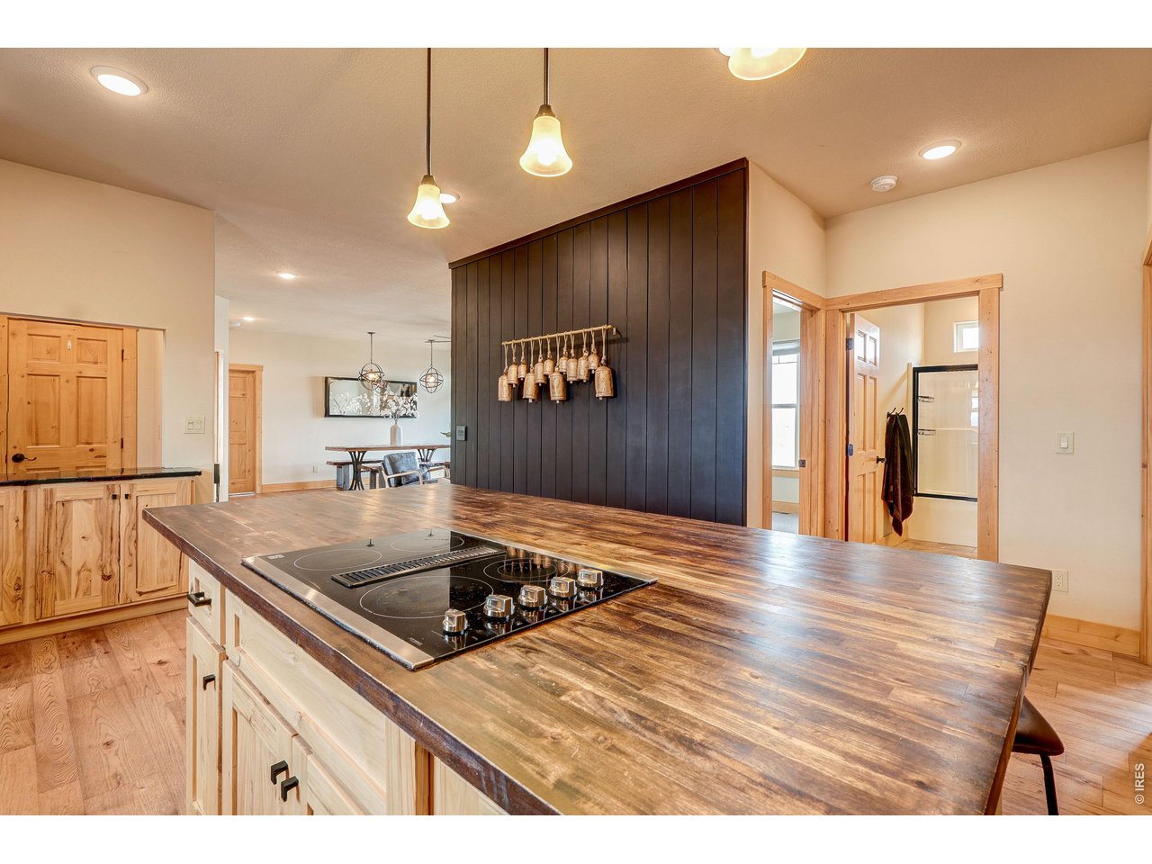 18298 Romar Ranch Road Carr, CO 80612 - Photo 15 of 49 a kitchen with stainless steel appliances granite countertop a sink a stove and a wooden floors
