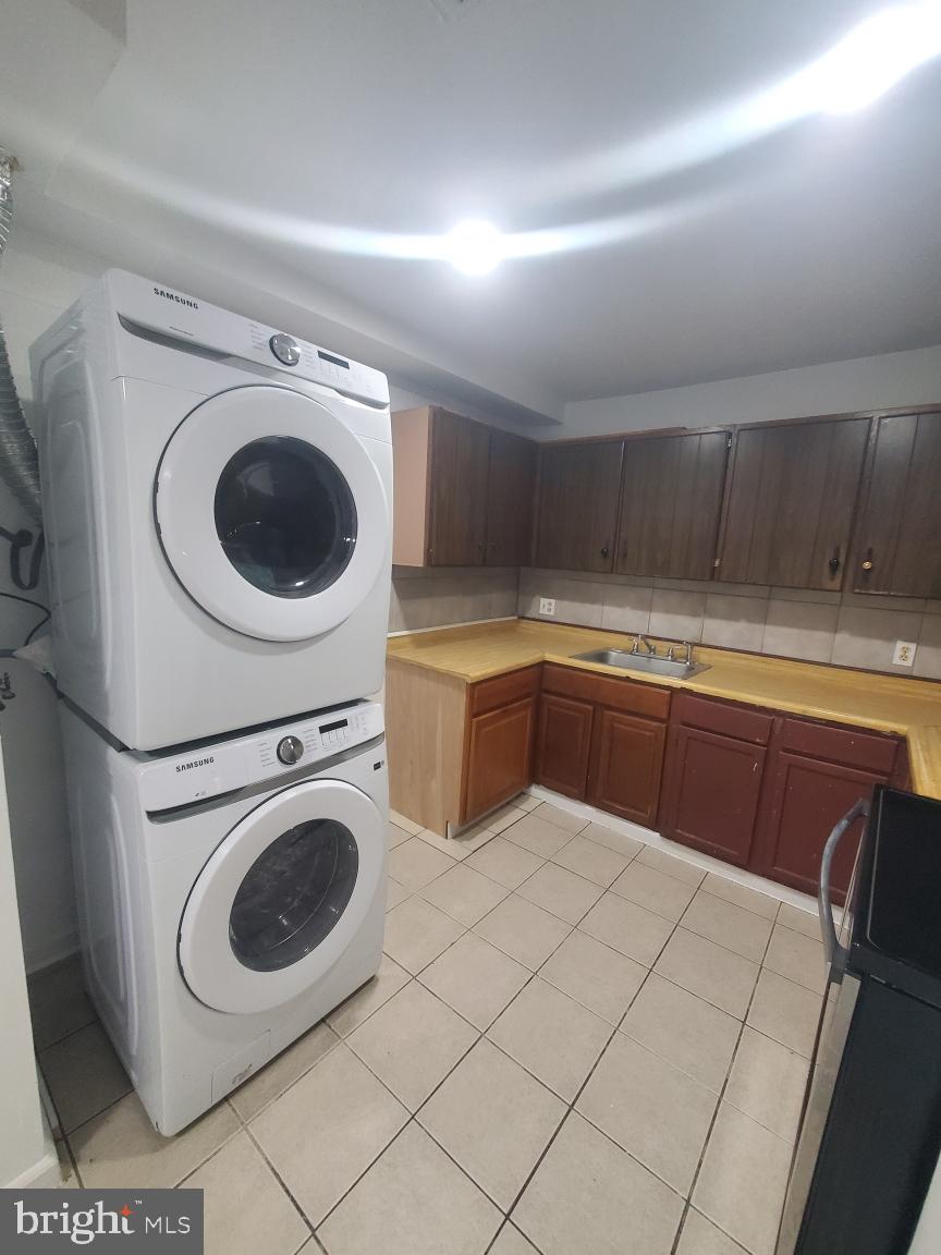 814 A Windstream Way, Unit 814A Edgewood, MD 21040 - Photo 14 of 15 a kitchen with a stove top oven sink and cabinets