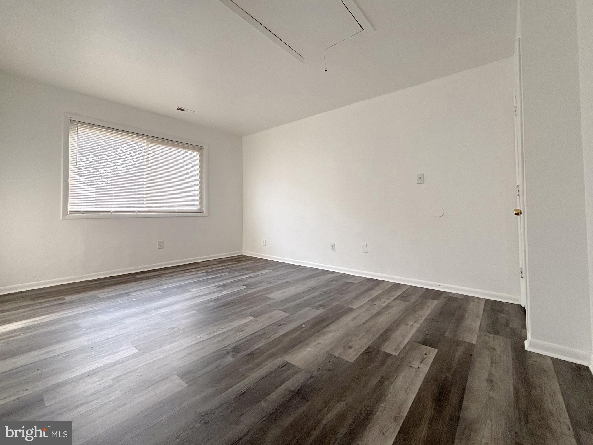 814 A Windstream Way, Unit 814A Edgewood, MD 21040 - Photo 17 of 27 an empty room with wooden floor and windows