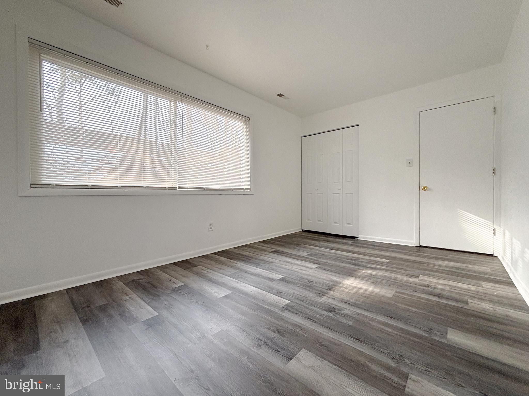 814 A Windstream Way, Unit 814A Edgewood, MD 21040 - Photo 24 of 27 a view of empty room with wooden floor and fan