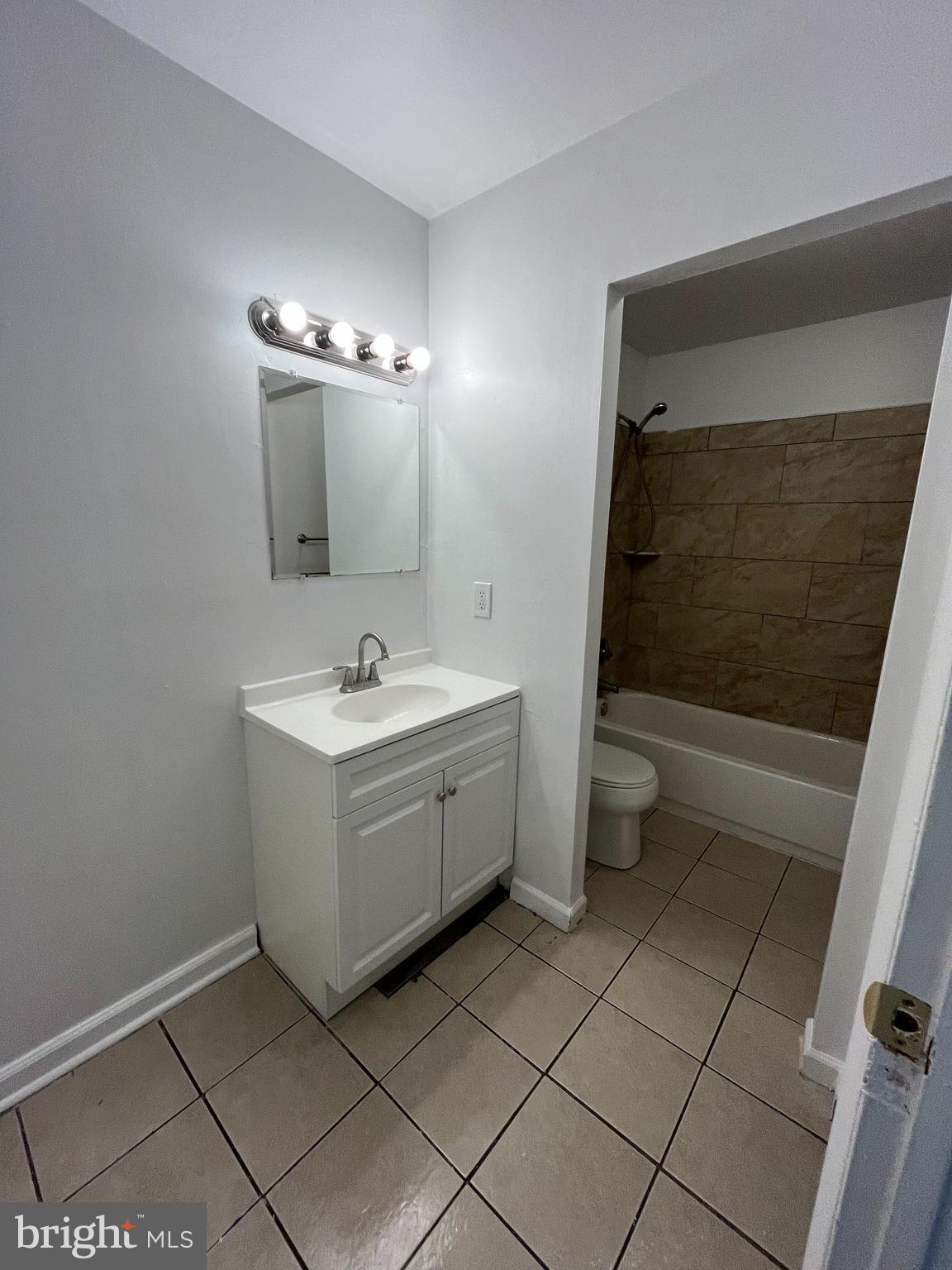 814 A Windstream Way, Unit 814A Edgewood, MD 21040 - Photo 6 of 15 a bathroom with a sink a toilet and shower