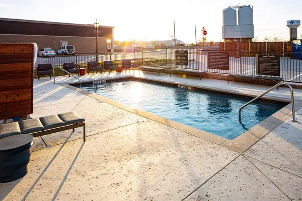 a view of swimming pool with outdoor seating