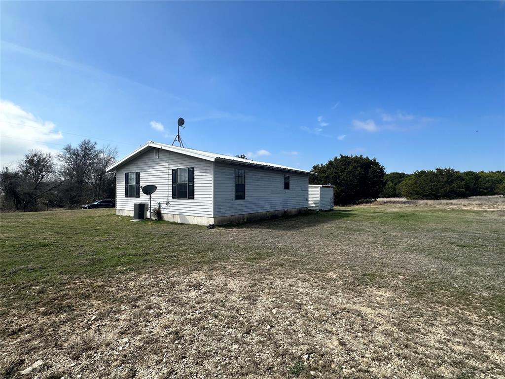 58 Haynes Road Weatherford, TX 76087 - Photo 11 of 12 a view of a house with a yard
