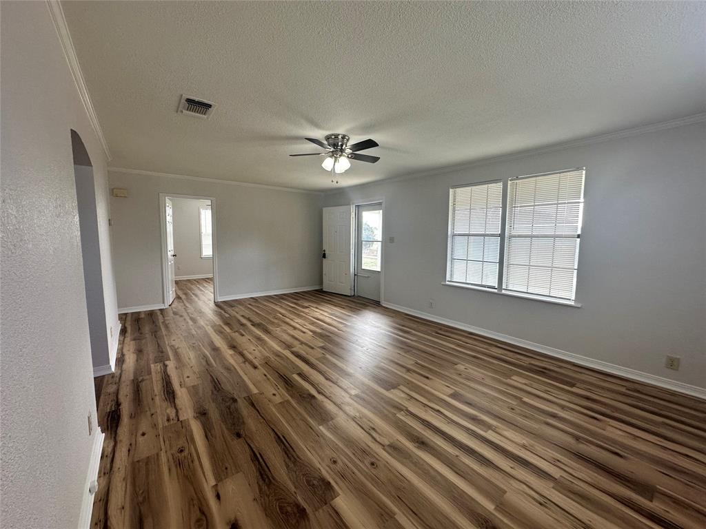 58 Haynes Road Weatherford, TX 76087 - Photo 5 of 12 wooden floor in an empty room with a window