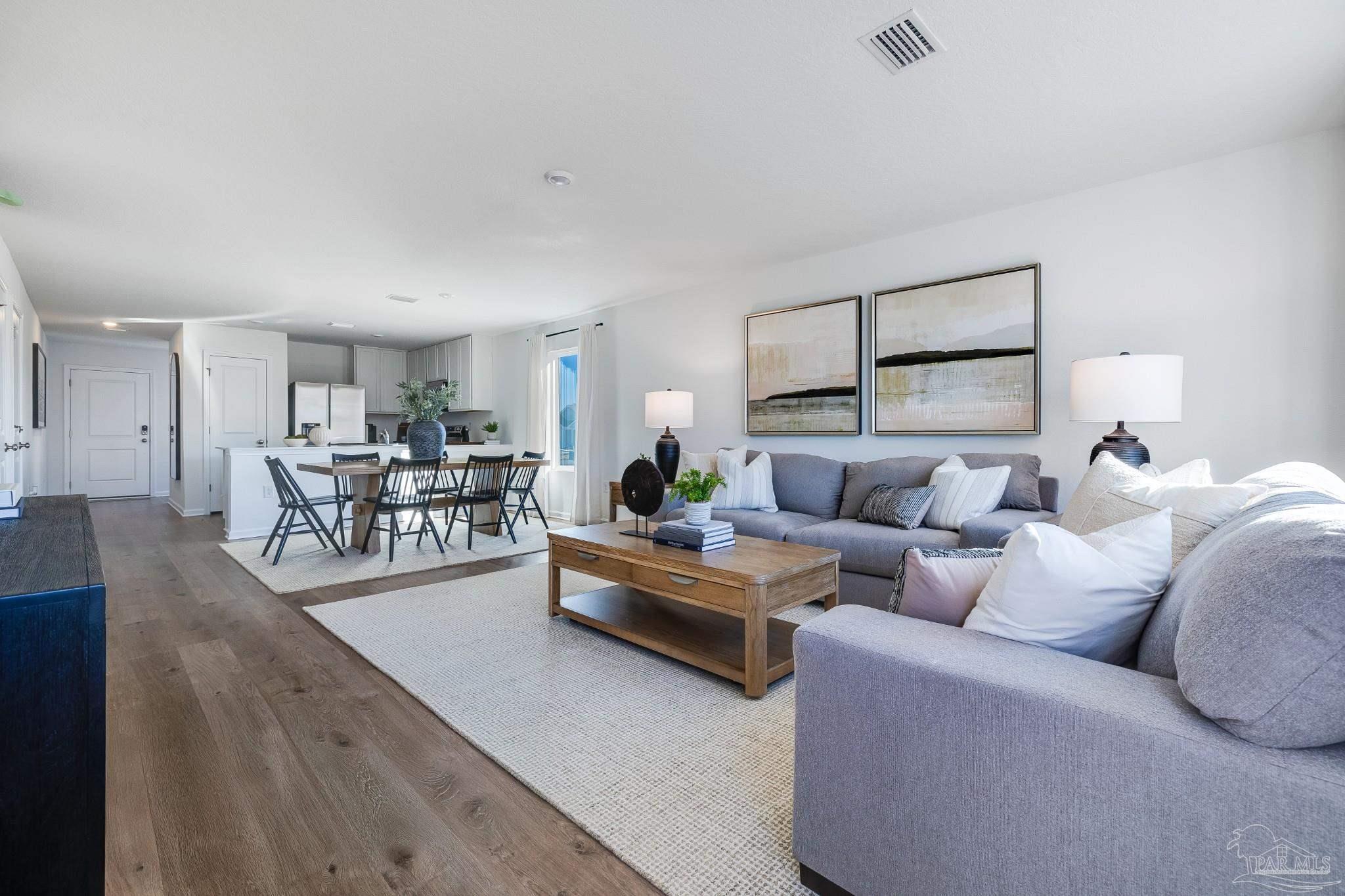 5360 Horizons Edge Lane Milton, FL 32583 - Photo 20 of 53 a living room with furniture and a wooden floor