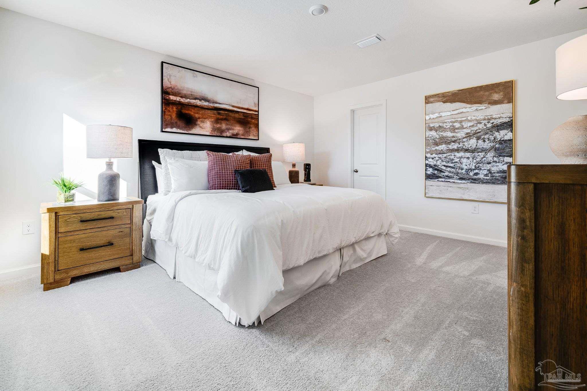 5360 Horizons Edge Lane Milton, FL 32583 - Photo 21 of 53 a bedroom with a bed a dresser and painting on the wall