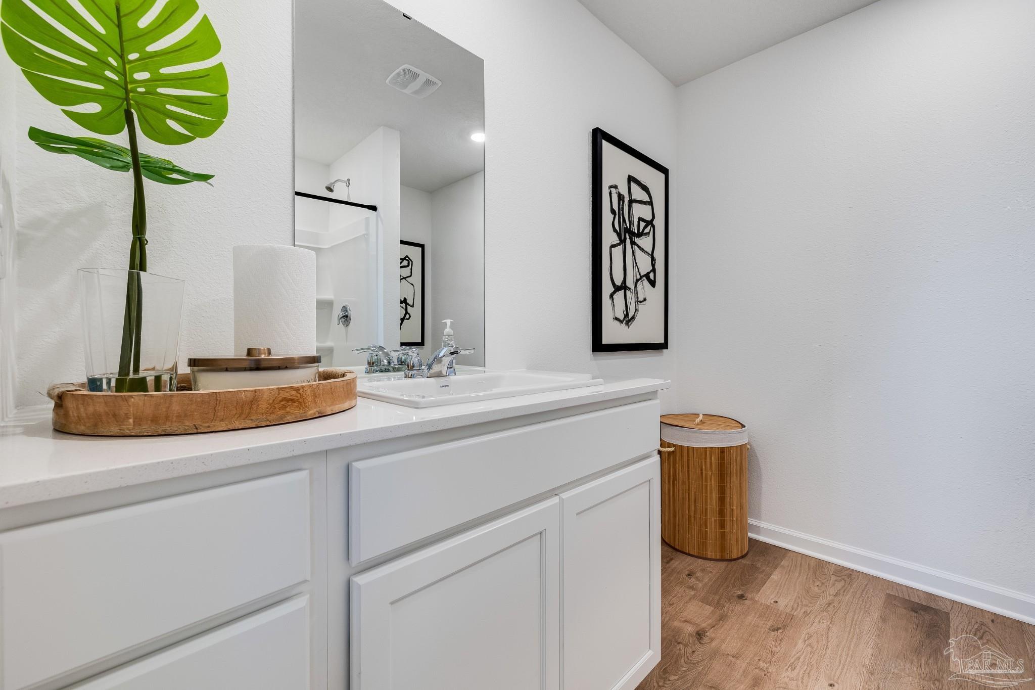 5360 Horizons Edge Lane Milton, FL 32583 - Photo 26 of 53 a bathroom with a sink and a mirror