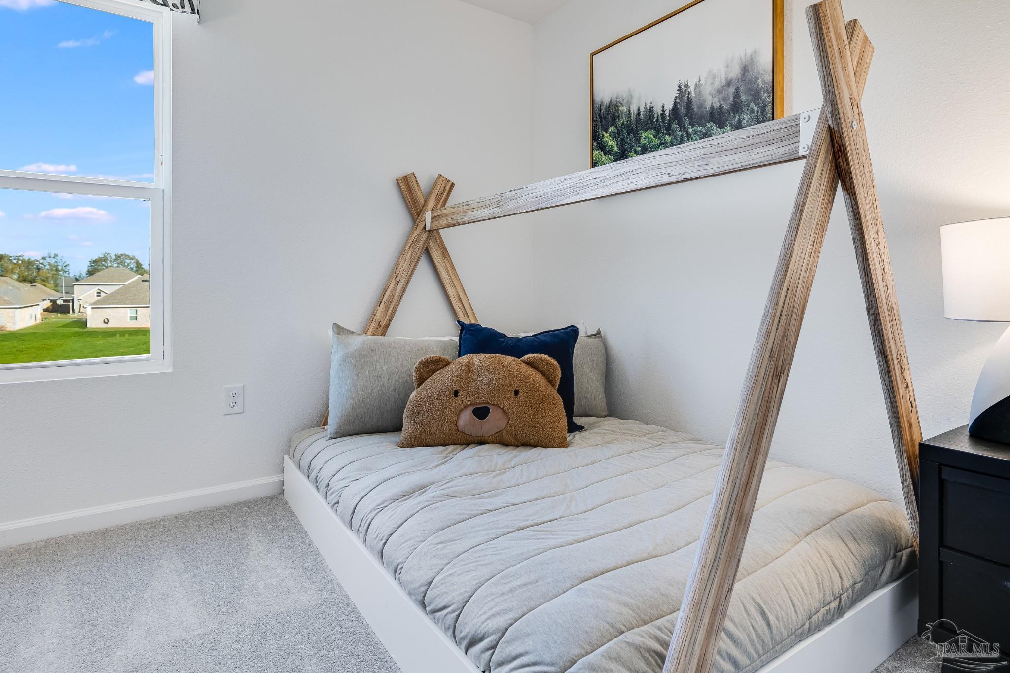 5360 Horizons Edge Lane Milton, FL 32583 - Photo 37 of 53 a bedroom with a bed and a painting on the wall