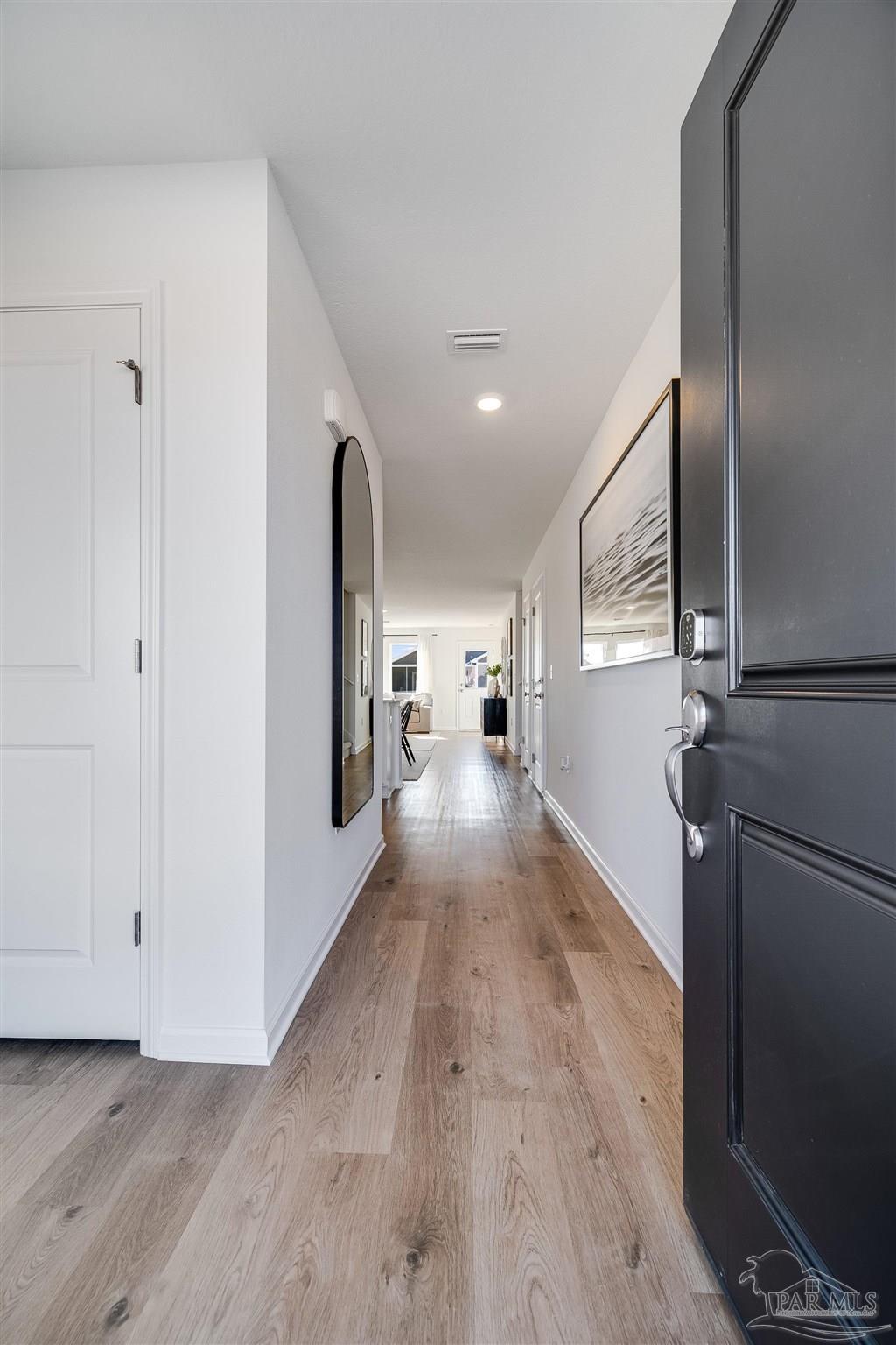 5360 Horizons Edge Lane Milton, FL 32583 - Photo 52 of 53 a view of a hallway with wooden floor