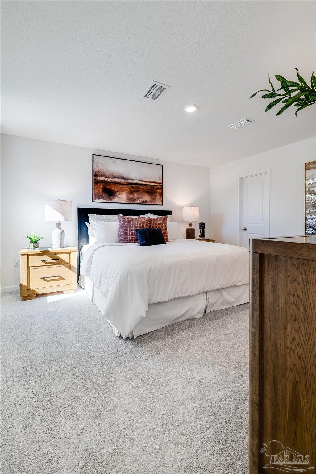 5360 Horizons Edge Lane Milton, FL 32583 - Photo 53 of 53 a bedroom with a bed and a chandelier