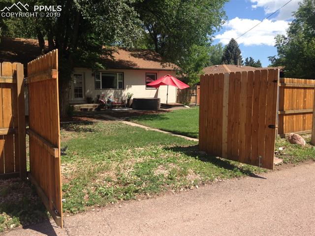 522 Valley Road Colorado Springs, CO 80904 - Photo 19 of 26 Back fence opens to alley access. Nice size area to park your toys or to build a garage.