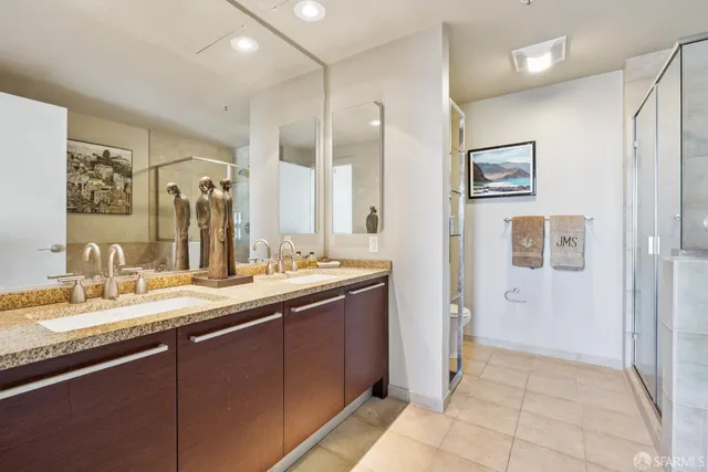 a bathroom with a granite countertop sink mirror and a