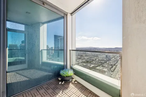 a view of a balcony with wooden floor