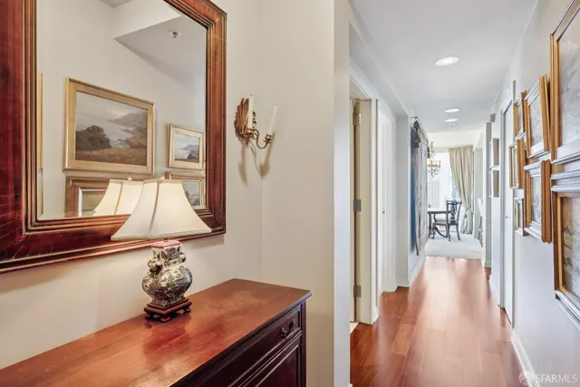 a hallway with a view of living room