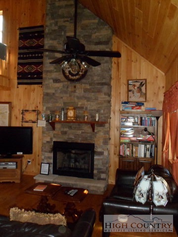 279 Indian Springs Road Boone, NC 28607 - Photo 6 of 15 a living room with furniture and a fireplace