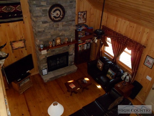 279 Indian Springs Road Boone, NC 28607 - Photo 7 of 15 a living room with a fireplace a rug and a fireplace