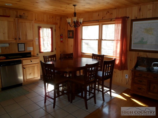 279 Indian Springs Road Boone, NC 28607 - Photo 10 of 15 a view of a dining room with furniture and window