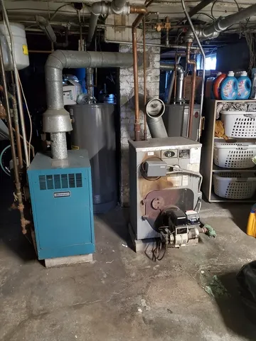 a room with furniture a chandelier and a wooden floor