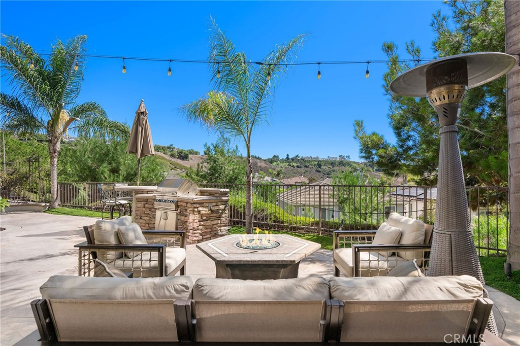 1204 Vista Jardin San Clemente, CA 92673 - Photo 14 of 55 a view of a patio with couches potted plants and a palm tree