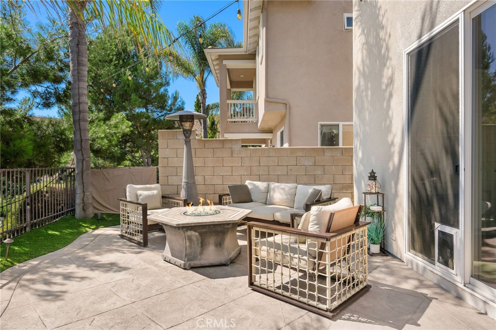1204 Vista Jardin San Clemente, CA 92673 - Photo 18 of 55 a view of a patio with couches table and chairs and potted plants