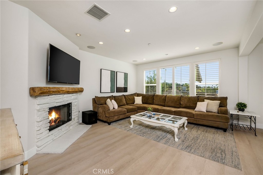 1204 Vista Jardin San Clemente, CA 92673 - Photo 20 of 55 a living room with furniture fireplace and flat screen tv