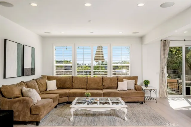 a kitchen with a refrigerator and a stove top oven