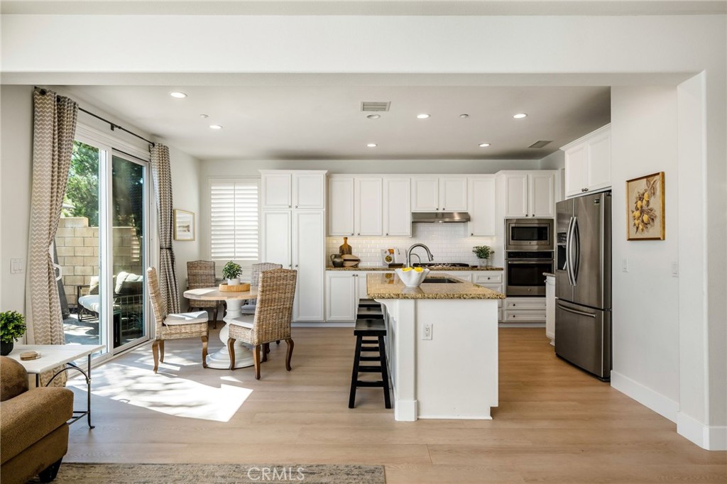 1204 Vista Jardin San Clemente, CA 92673 - Photo 22 of 55 a kitchen with a refrigerator and a stove top oven