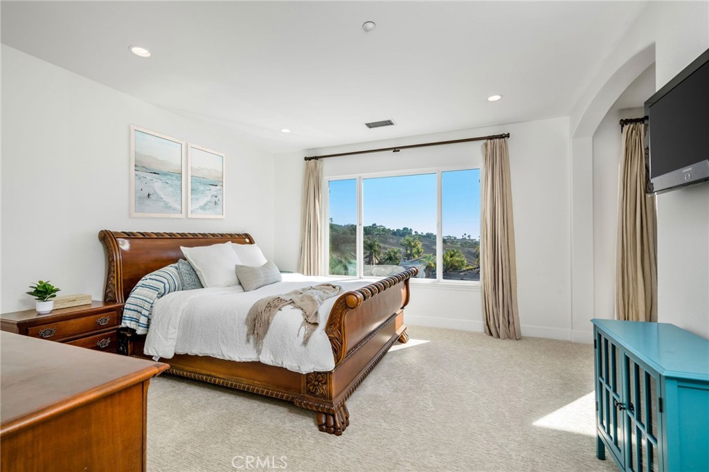 1204 Vista Jardin San Clemente, CA 92673 - Photo 27 of 55 a bed room with a bed and a television