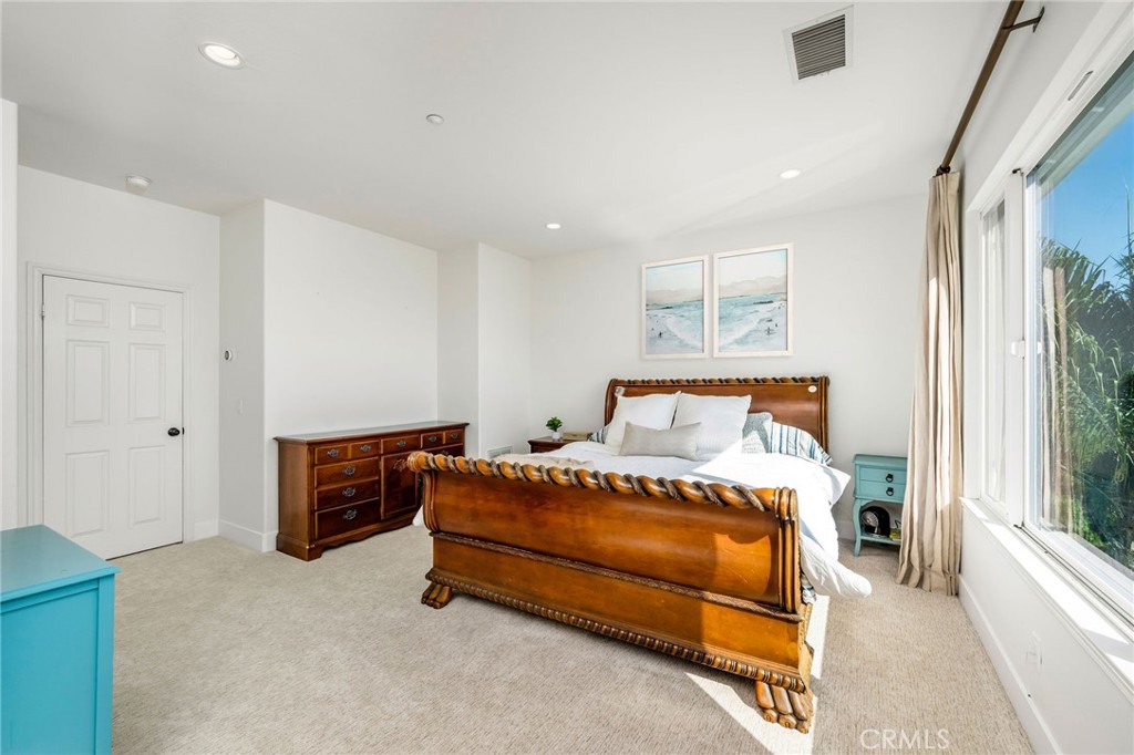 1204 Vista Jardin San Clemente, CA 92673 - Photo 30 of 55 a bedroom with a bed and a window