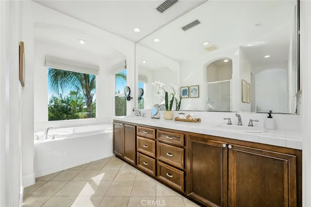 a bathroom with a bathtub and a sink